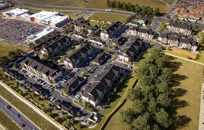 Aerial view of a suburb of a city with cars on the street at Premier at West Park, Greeley, CO