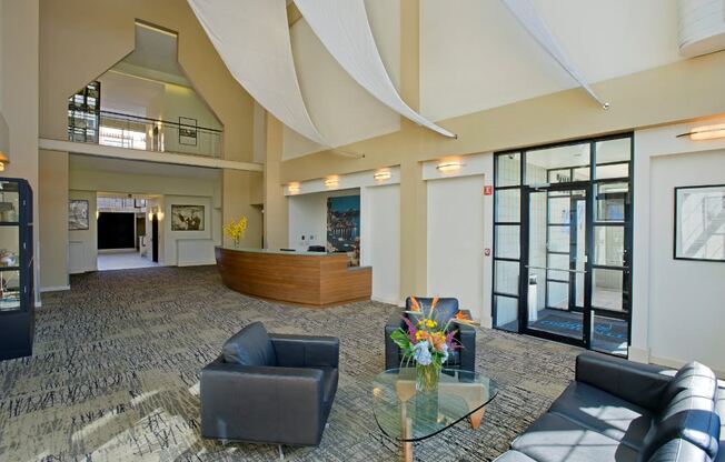 the lobby of a building with couches and a table at Tindeco Wharf, Baltimore, 21224