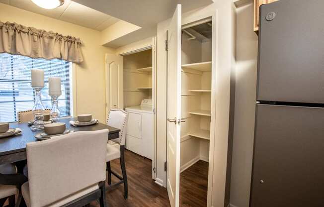 Full Size washer and dryer with kitchen storage at Ivy Hall Apartments
