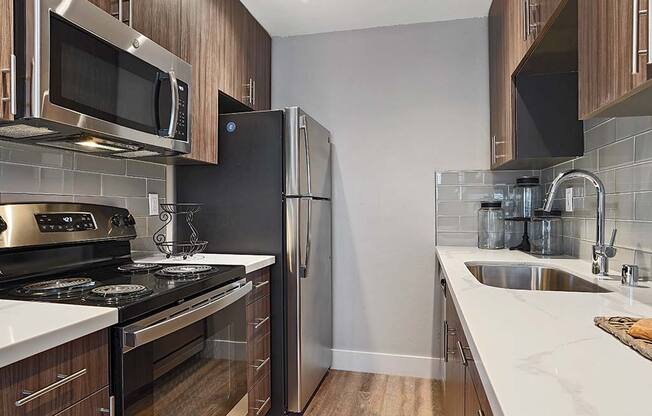 Fully Equipped Kitchen Includes Frost-Free Refrigerator, Electric Range, & Dishwasher at Fairmont Apartments, Pacifica