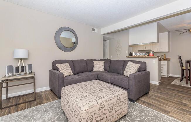 a living room filled with furniture and a flat screen tv