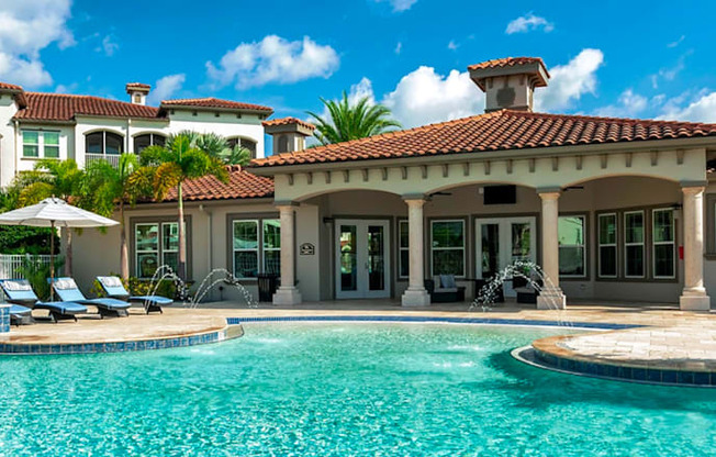 a large swimming pool in front of a house