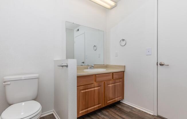 a room with a sink and a mirror