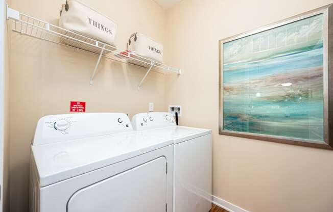 a washer and dryer in the laundry room of a rental home