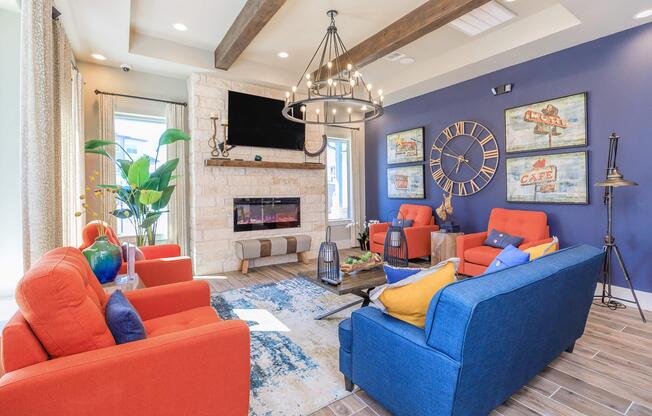 a living room with blue furniture and a fire place