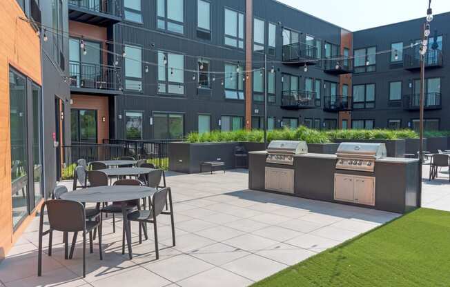 Outdoor Grill With Intimate Seating Area at CityLine Apartments, Minnesota, 55406