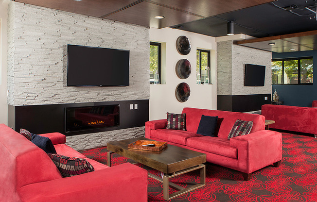 Multiple social lounges with fireplaces and flatscreen TVs