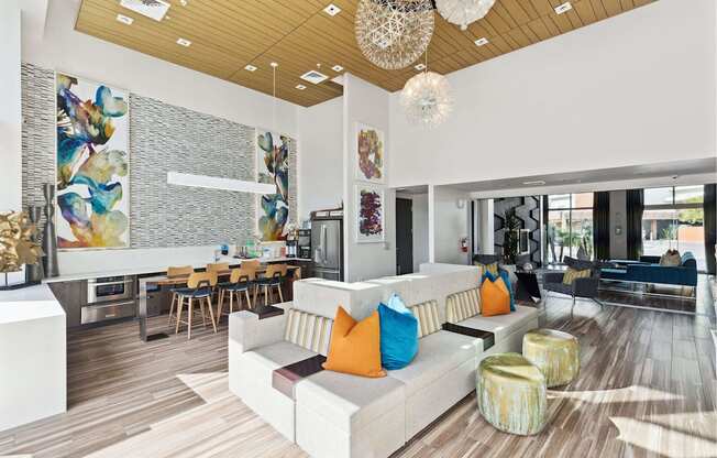 A modern living room with a white couch and a wooden floor.