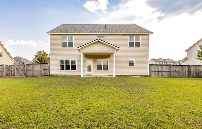 Welcome to this charming 4-bedroom, 3.5-bath home in Raeford