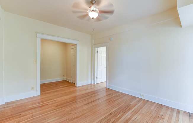 vacant bedroom with hardwood floors, large closet and ceiling fan  at twin oaks apartments columbia heights washington dc