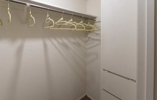 This is a photo of the hallway walk-in closet with built-in shelving of the 590 square foot 1 bedroom, 1 bath model apartment at The Biltmore Apartments located int he Vickery Meadow neighborhood of Dallas, TX.
