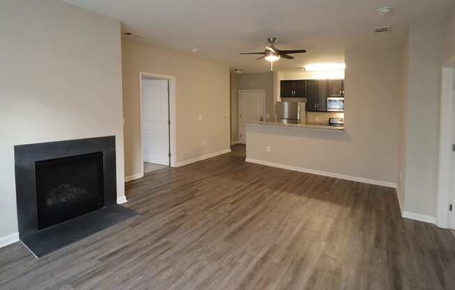 Renovated unit with plank flooring and fireplace