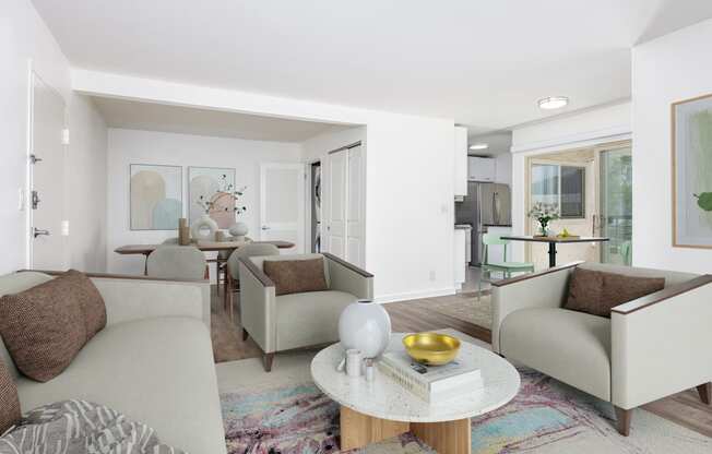 a living room with couches and chairs and a table