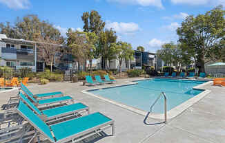 Community Swimming Pool with Pool Furniture at Colonnade at Fletcher Hills Apartments in El Cajon, CA.