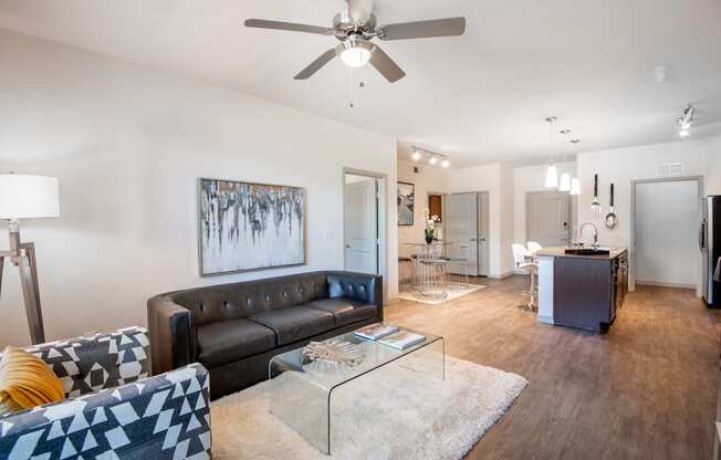 a living room with a couch and a glass table