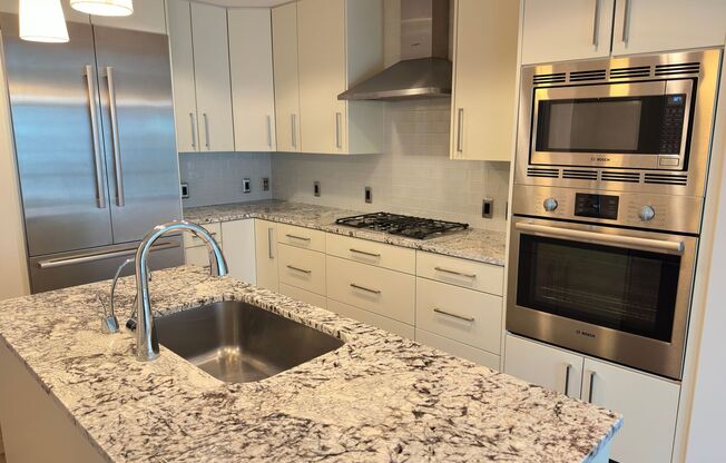 Stunning 2 bed (Primary bedroom + den w/closet), 2 bath condo located in the heart of downtown Bethesda.
