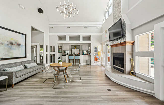 A modern living room with a wooden floor and a fireplace at Beacon Ridge Apartments, PRG Real Estate Management, Greenville, 29615
