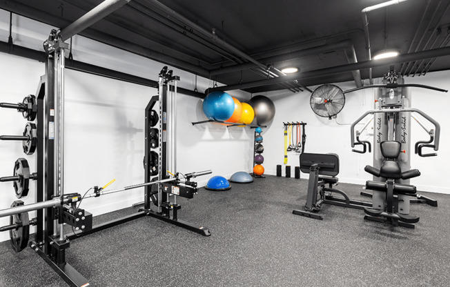 Fitness center Including cycling bikes, ellipticals, treadmills, free weights, and stretching balls.