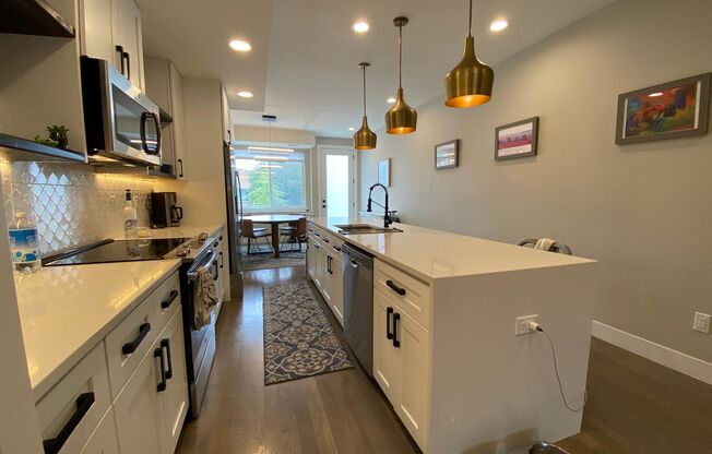 Modern 2 Bed | 3.5 Bath Townhome with Bonus Loft & Rooftop Deck!