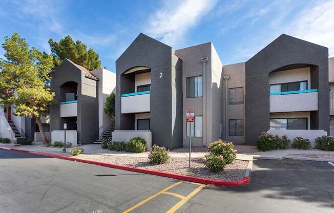 A building with a red stop sign in front of it.