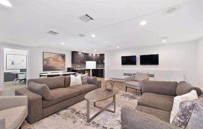A living room with a grey couch and a coffee table.