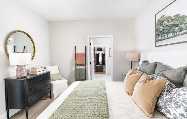 A spacious layout flows seamlessly into a walk-in closet, with soft tones and thoughtful finishes that make getting ready feel effortless.