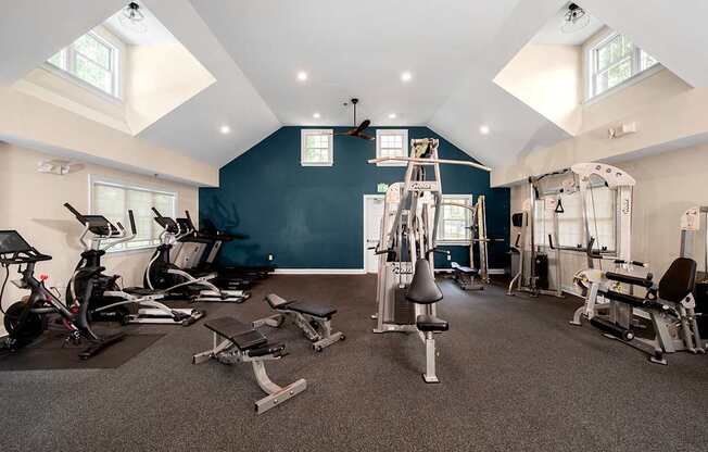 A spacious gym with a variety of exercise equipment.