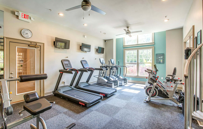 the gym with treadmills and bikes at the condos