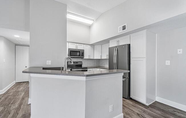 a large white refrigerator in a kitchen