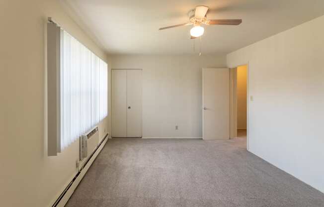 This is a photo of the primary bedroom in the 1004 square foot, 2 bedroom, 1.5 bath townhome floor plan at Lake of the Woods Apartments in Cincinnati, OH.