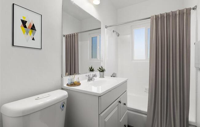 a bathroom with a sink toilet and shower at Pacific Rose, Los Angeles, CA