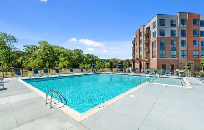 resort-style swimming pool with sun deck, grills, lounges, fire pits & games in Exton PA apartment building.