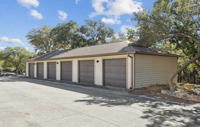 a garage with four roll up garage doors