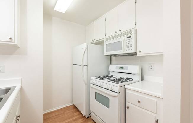 Kitchen with White Appliances and White Cabinets