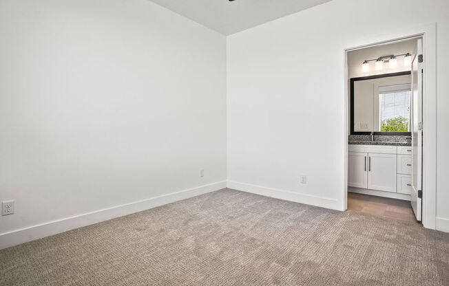 an empty room with a sink and a mirror  at Aero Luxury Townhomes in Layton, Utah