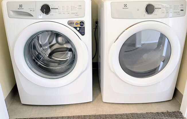 a washer and dryer in a room next to a washing machine