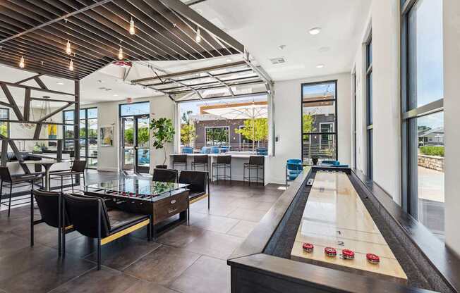 a game room with a foosball table and a ping pong table