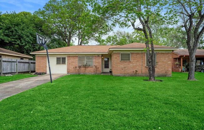 Three bedroom one and half bath brick home located on a lovely street. Large rooms and plenty of storage. Garage was converted to a large den/family room. Cute kitchen with a window over the kitchen sink. Enormous back yard perfect for outdoor entertainin