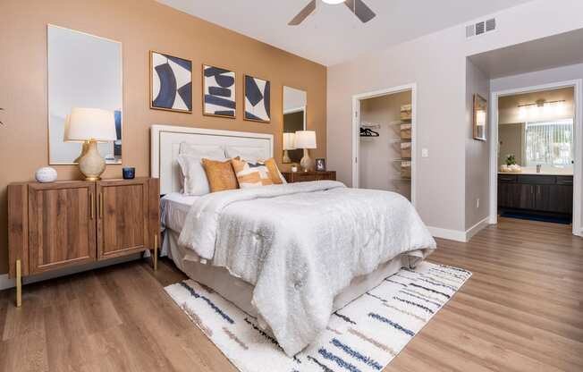 a bedroom with a bed and a ceiling fan