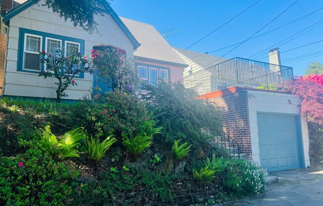 Charm Galore in this Beautiful 1920s Home near Fremont. Fresh Paint inside and out! New carpet
