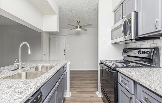 a kitchen with a stove and a sink