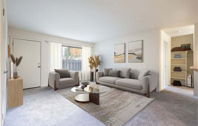 A living room with a grey sofa, a coffee table, and a rug.