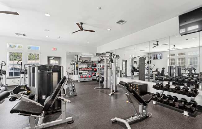 a gym with cardio machines and other exercise equipment