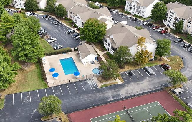 view of apartment buildings with off street parking