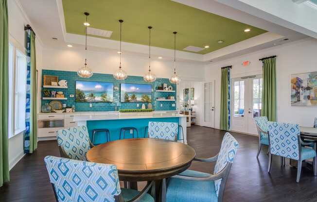 a dining room with blue chairs and a table