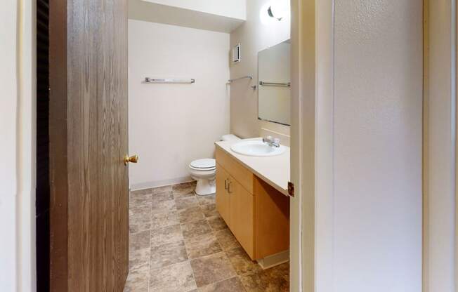 a bathroom with a toilet and a sink