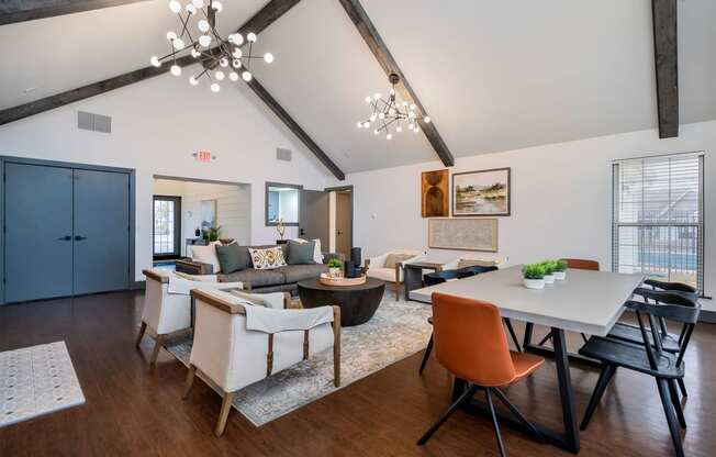 apartment resident club house lounge with sofa chairs and long table