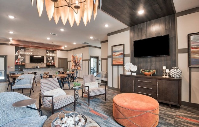 a living room filled with furniture and a tv