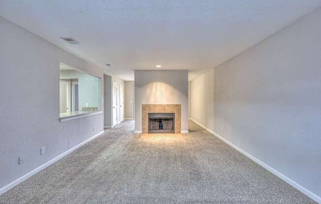 A long, empty hallway with a fireplace at the end at Landmark at Lyncrest Reserve Apartments, Nashville, TN, 37209