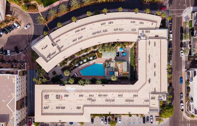 A large building with a pool in the middle of it.